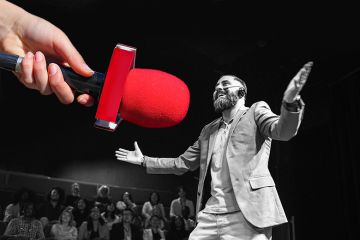 Man speaking to audience, with a large hand offering a microphone. To illustrate how speakers’ bureaux can boost academic authors’ profiles.