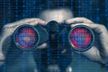 Someone looks through binoculars with binary code in the lenses Someone looks through binoculars with binary code in the lenses