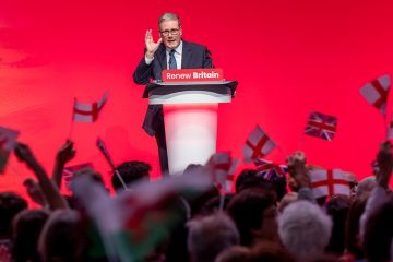 Delegates wave flags as Sir Keir Starmer, the British Prime Minister and leader of the Labour Party delivers his speech to several standing ovations at the 2025 Labour Party Conference on the 30 September 2025 in Liverpool, United Kingdom.