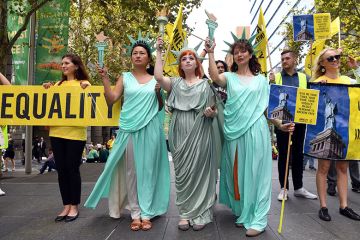 Women wearing Statue of Liberty costumes protest US President Donald Trump's immigration policies in Sydney's Martin Place on 9 March, 2017. To illustrate the affect Trump's policies against DEI practices are having on Australian research. Women wearing Statue of Liberty costumes protest US President Donald Trump's immigration policies in Sydney's Martin Place on 9 March, 2017. To illustrate the affect Trump's policies against DEI practices are having on Australian research.