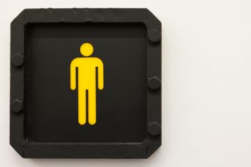 A stickman in yellow against a black background A stickman in yellow against a black background