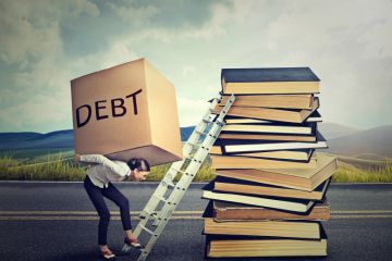 Student loan debt concept. Woman with heavy box Student loan debt concept. Woman with heavy box
