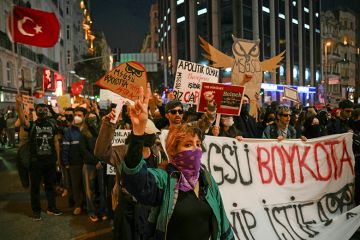Students walk behind a banner reading "The university is boycotting. Tayyip resign (in reference to Turkey's President Recep Tayyip Erdogan)" march along a street during a rally in support of Istanbul's arrested mayor, in Istanbul, on 25 March 2025