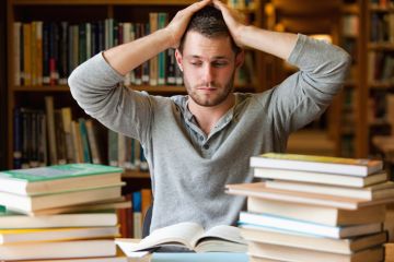 istock student tired books library A tired student in the library