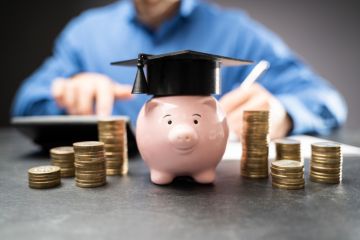 A piggy bank with a mortar board A piggy bank with a mortar board
