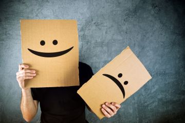 Student satisfaction Happy and sad cardboard faces