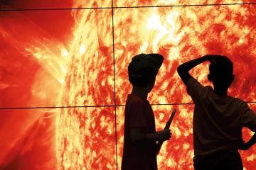 children look at the sun