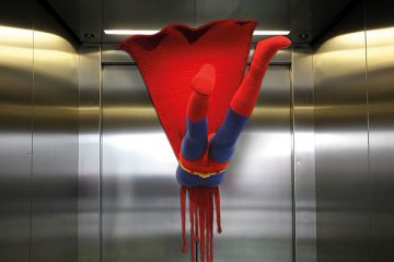 Superman flying into a closed lift door Superman flying into a closed lift door