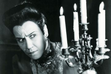 Suspicious woman holding candles Suspicious woman holding candles