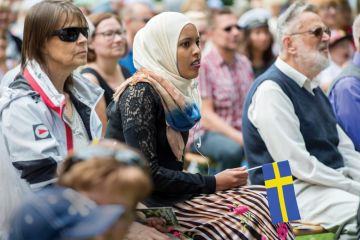 Swedish people participating in National Day of Sweden celebrations, Norrköping, Sweden
