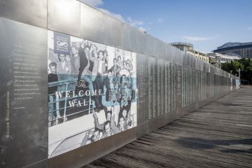 Sydney, Australia - May 22, 2017 At the Australian National Maritime Museum. The Welcome Wall along the walkway of Pyrmont Bay jetty. Sydney, Australia - May 22, 2017 At the Australian National Maritime Museum. The Welcome Wall along the walkway of Pyrmont Bay jetty.