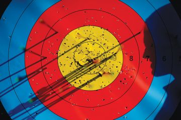 Silhouette in front of a target Silhouette in front of a target, symbolising targets for Office for Students under Sir Michael Barber