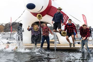 Participants jump into the water during the Minnesota Polar Plunge Participants jump into the water during the Minnesota Polar Plunge to illustrate Teach for America at turning point as numbers participating drop off