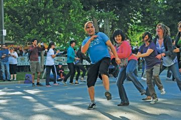 Members of the public perform the Conga dance Members of the public perform the Conga dance