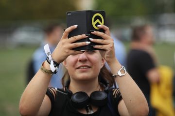 Woman filming with phone