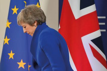 Britain's Prime Minister Theresa May leaves after a press conference following a special meeting of the European Council to endorse the draft Brexit withdrawal agreement 