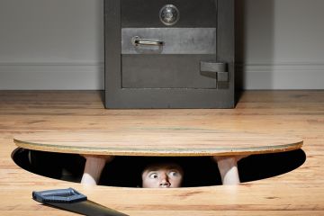 man trying to steal a safe