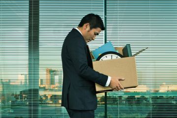 Fired man carrying box Fired man carrying box