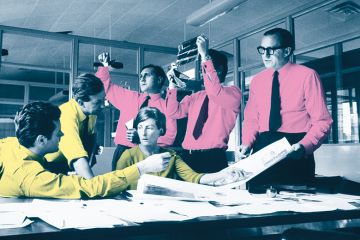 Editors having a discussion around a table