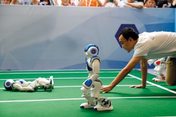 Robots run in a robot relay race as part of the 2017 World Robot Conference in Beijing, China. Robots run in a robot relay race as part of the 2017 World Robot Conference in Beijing, China.