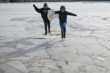 Protestors run over breaking ice