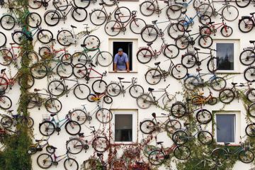 Christian Petersen looks out of shop window, Altlandsberg, Berlin, 2010
