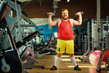 Man lifting weights in a gym