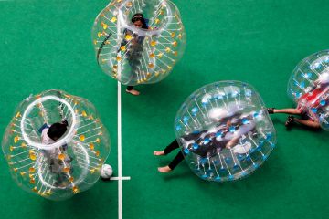 Participants enjoying bubble soccer