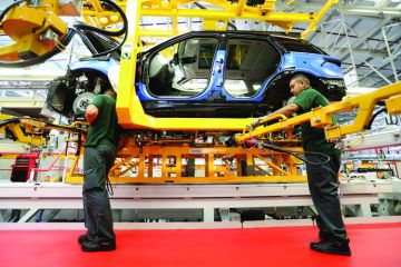 Production line employees working on Range Rover Production line employees working on Range Rover