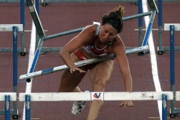 Hurdler runs into hurdle