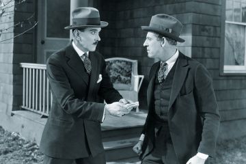 Man offering other man money