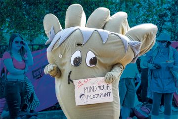 Climate protester dressed as a giant carbon footprint Climate protester dressed as a giant carbon footprint