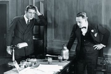 Two men looking surprised in an office Two men looking surprised in an office