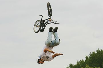 A BMX rider falls as he competes in the National Adventure Sports Show in Shepton Mallet, Somerset, south west England A BMX rider falls as he competes in the National Adventure Sports Show in Shepton Mallet, Somerset, south west England