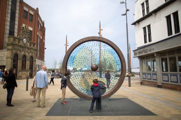 Pedestrians look at the The Keel Line memorial, built to remember Sunderland's shipping industry in Sunderland, U.K