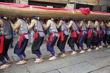 24 seniors villagers carry a giant wooden pillar ("long zhu" in Chinese) on their shoulders to celebrate the 11th China's Cultural Heritage Day on June 11, 2016 in Fuzhou, Fujian Province of China 24 seniors villagers carry a giant wooden pillar ("long zhu" in Chinese) on their shoulders to celebrate the 11th China's Cultural Heritage Day on June 11, 2016 in Fuzhou, Fujian Province of China
