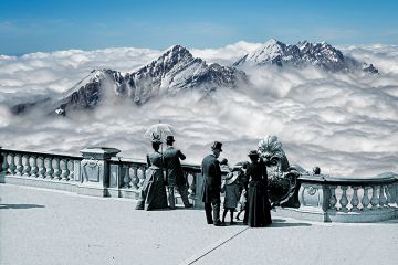 Montage of historical people wearing top hats and holding parasols overlooking mountain peaks and clouds. Montage of historical people wearing top hats and holding parasols overlooking mountain peaks and clouds.