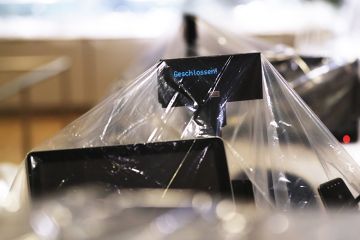 Plastic covers wrap around check-out counters in the closed restaurant and dining area inside a store in Berlin, Germany, on Wednesday, May 20, 2020 Plastic covers wrap around check-out counters in the closed restaurant and dining area inside a store in Berlin, Germany, on Wednesday, May 20, 2020