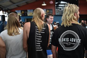 Men wait to be judged on their mullet hairstyles at Mulletfest 2018 in the town of Kurri Kurri, 150 kms north of Sydney, Australia Men wait to be judged on their mullet hairstyles at Mulletfest 2018 in the town of Kurri Kurri, 150 kms north of Sydney, Australia