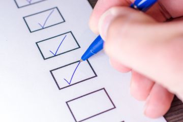 A person ticking boxes A person ticking boxes