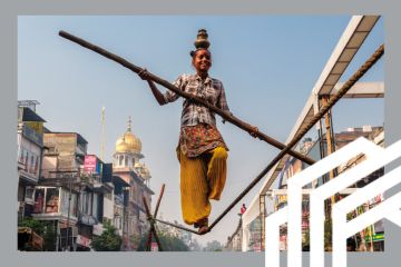 A young tightrope walker balances on a rope with a pole and a pot on her head, in Old Delhi, India. To illustrate a rebalancing of the ratings as lower-income nations are narrowing the gap on wealthier competitors A young tightrope walker balances on a rope with a pole and a pot on her head, in Old Delhi, India. To illustrate a rebalancing of the ratings as lower-income nations are narrowing the gap on wealthier competitors