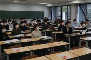 Students wearing masks in a classroom Students wearing masks in a classroom
