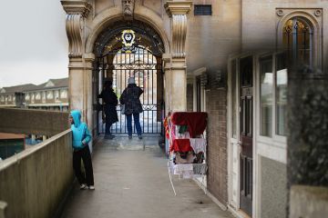 Montage of housing estate in Rochdale with a closed gate of Trinity Hall, Cambridge. To illustrate whether a university degree is any longer a passport to social mobility.