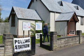 Trowbridge, UK - May 5, 2016 A voter visits a polling station at a church. Trowbridge, UK - May 5, 2016 A voter visits a polling station at a church.