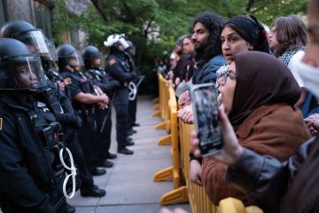 University police are confronted by protestors on the University of Chicago campus while they break up a pro-Palestinian encampment to illustrate The problem of US campus policing