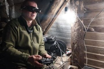 A Ukranian soldier operating a controller