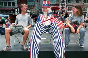 Uncle Sam taking a break in the Harbor Festival at Faneual hall to illustrate I miss adrenaline of government, says Harvard’s soft power pioneer