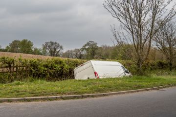 Unidentifiable white van in ditch Unidentifiable white van in ditch