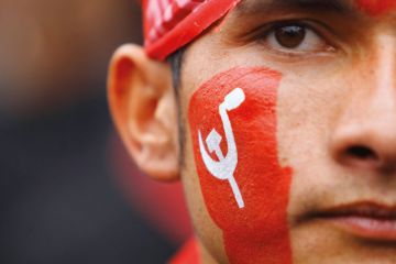 Unified Communist Party of Nepal supporter with painted face Unified Communist Party of Nepal supporter with painted face