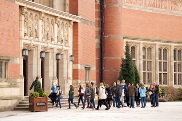 People in Chancellors Court, University of Birmingham, a red brick university, Edgbaston campus, UK People in Chancellors Court, University of Birmingham, a red brick university, Edgbaston campus, UK